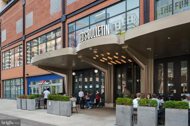a city street lined with buildings and cars