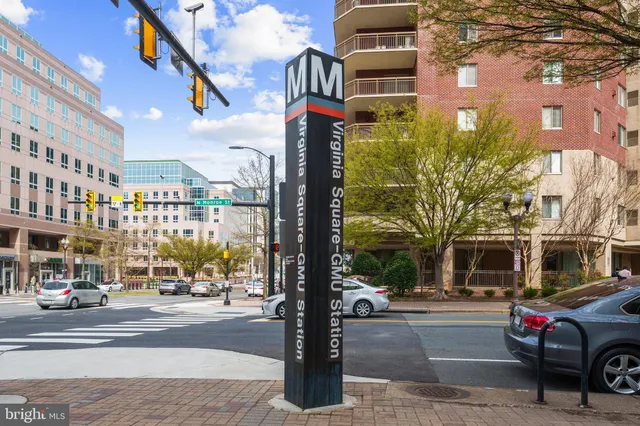 a front view of a building with porch and outdoor seating