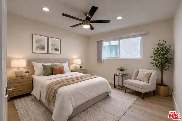 a bedroom with a bed and a couch