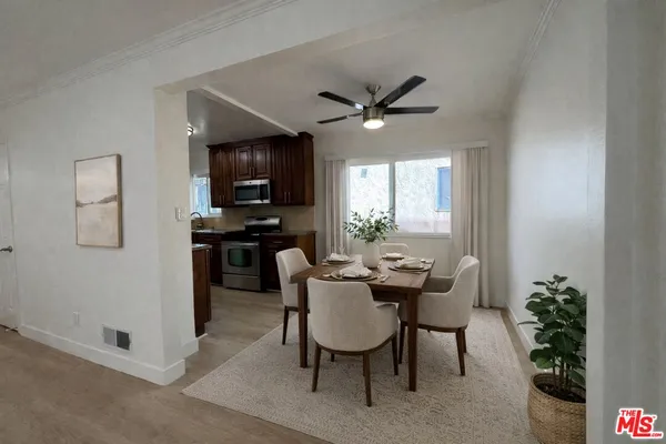 a dining room with furniture and window