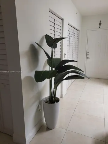 a living room with furniture pool table and a table