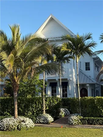 a front view of a house with yard