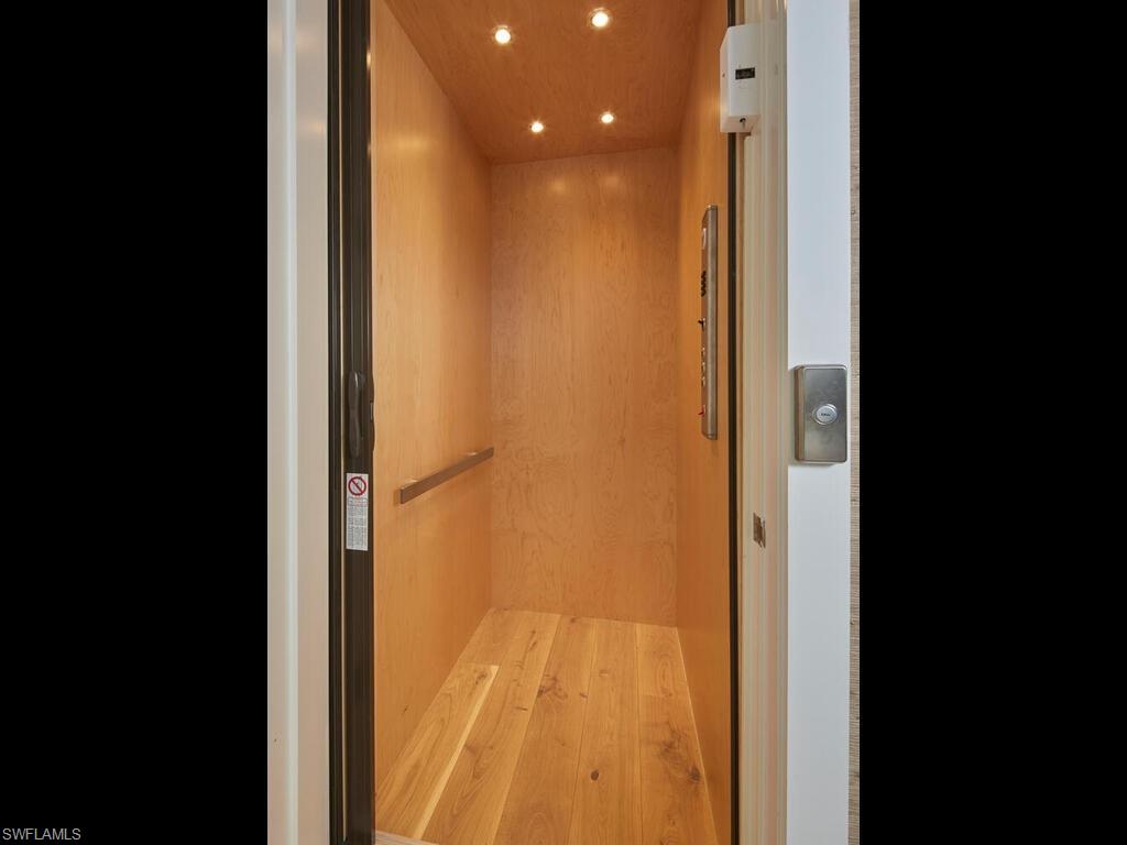 909 10th Avenue South Naples, FL 34102 - Photo 13 of 34 a view of a bathroom from a hallway