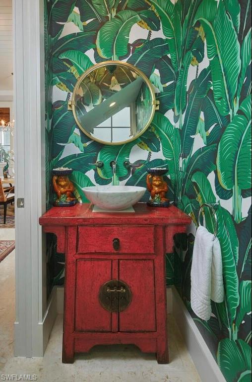 909 10th Avenue South Naples, FL 34102 - Photo 14 of 34 a room with painting on the wall and a potted plant