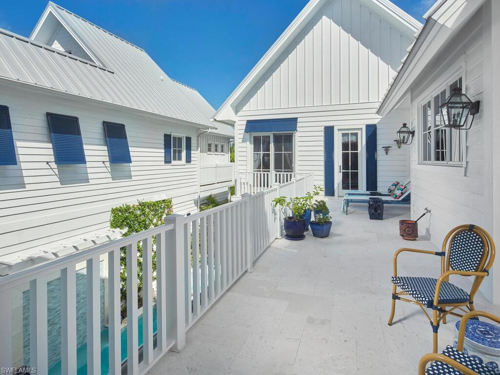 909 10th Avenue South Naples, FL 34102 - Photo 20 of 34 a view of a house with backyard and furniture