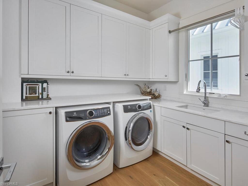 909 10th Avenue South Naples, FL 34102 - Photo 27 of 34 a utility room with sink dryer and washer