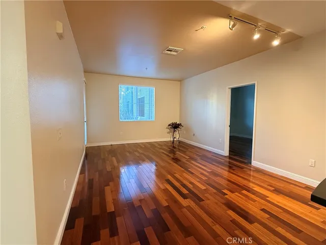 a kitchen with sink refrigerator and microwave