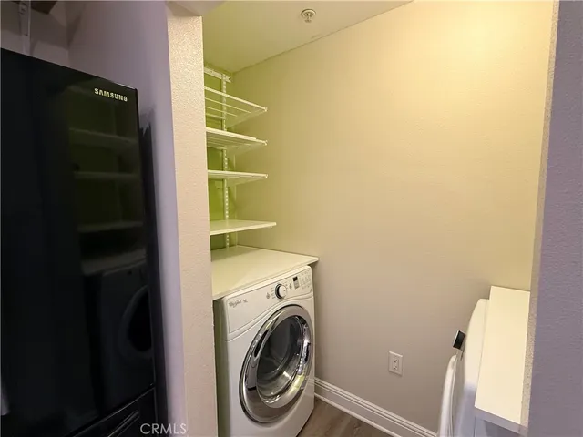 a bathroom with a double vanity sink toilet mirror and shower