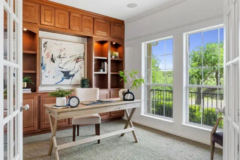 a view of a a dining room with furniture window and wooden floor