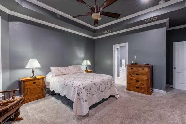 a bedroom with a bed and a cabinets