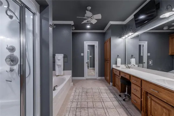 a bathroom with a double vanity sink and a mirror