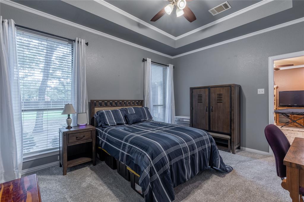 320 Rustic Oaks Road Combine, TX 75159 - Photo 28 of 40 Bedroom with carpeted floors, crown molding, and ceiling fan