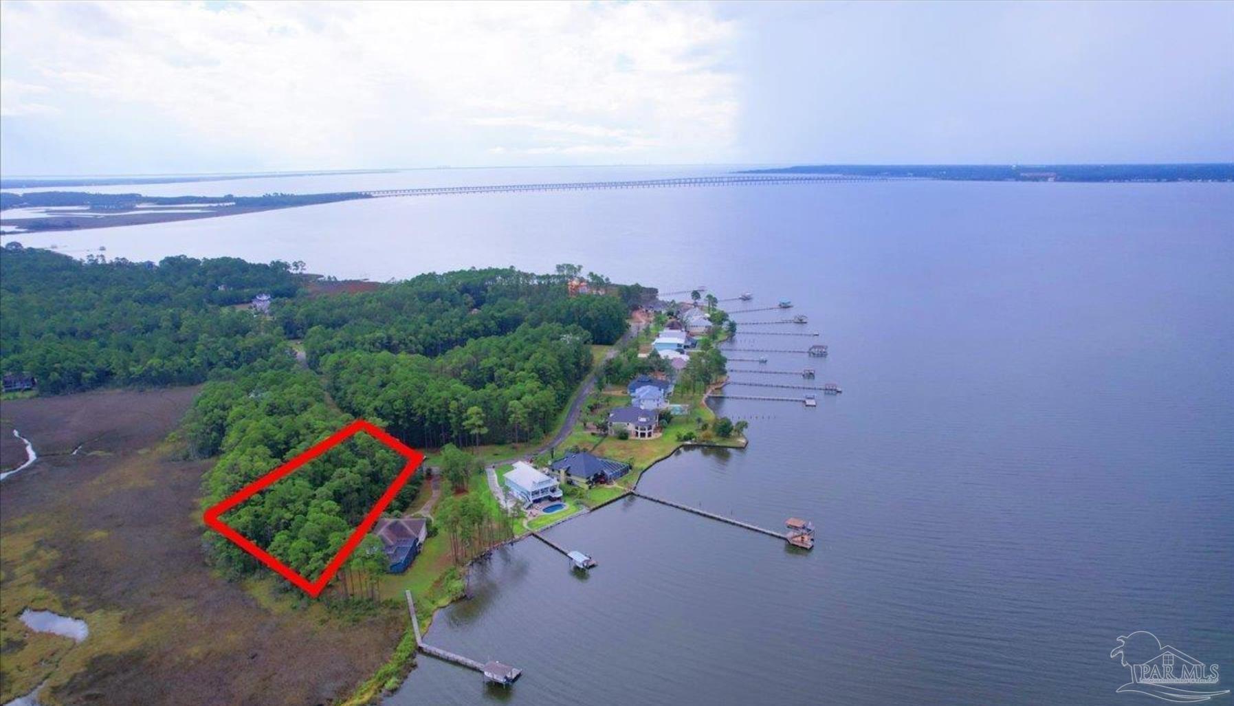 4568 Bayside Drive Milton, FL 32583 - Photo 1 of 13 an aerial view of a houses with a lake view