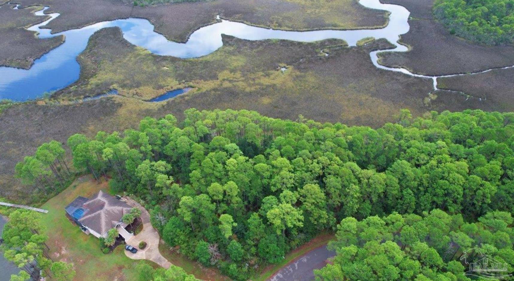 4568 Bayside Drive Milton, FL 32583 - Photo 2 of 13 a view of a backyard