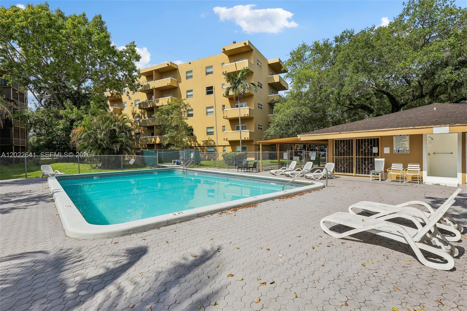 4147 Stirling Road, Unit 105 Dania Beach, FL 33314 - Photo 16 of 16 swimming pool view with a seating space