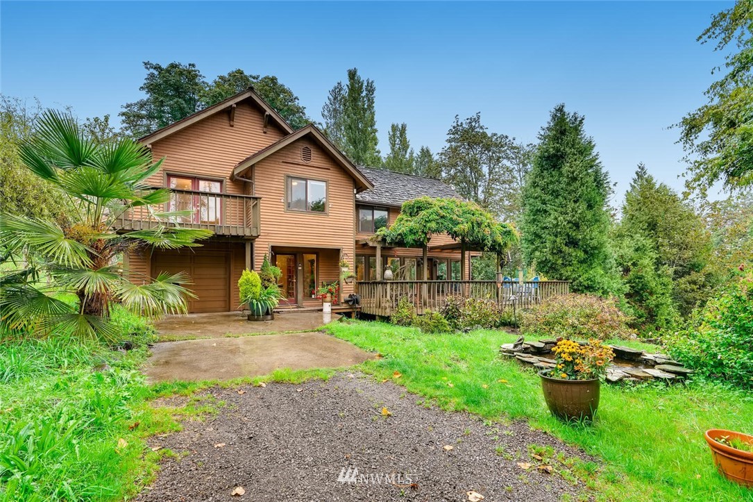 21612 High Bridge Road Monroe, WA 98272 - Photo 1 of 22 a front view of a house with garden