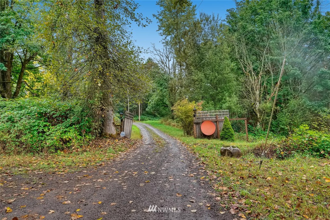 21612 High Bridge Road Monroe, WA 98272 - Photo 2 of 22 a backyard of a house with lots of green space