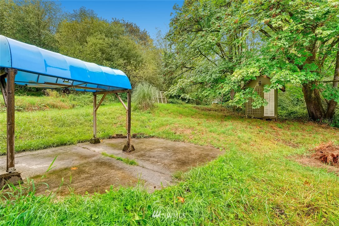 21612 High Bridge Road Monroe, WA 98272 - Photo 22 of 22 a view of a back yard of the house with a street