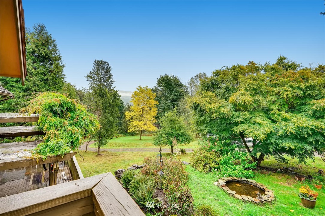 21612 High Bridge Road Monroe, WA 98272 - Photo 6 of 22 a view of a garden with lawn chairs