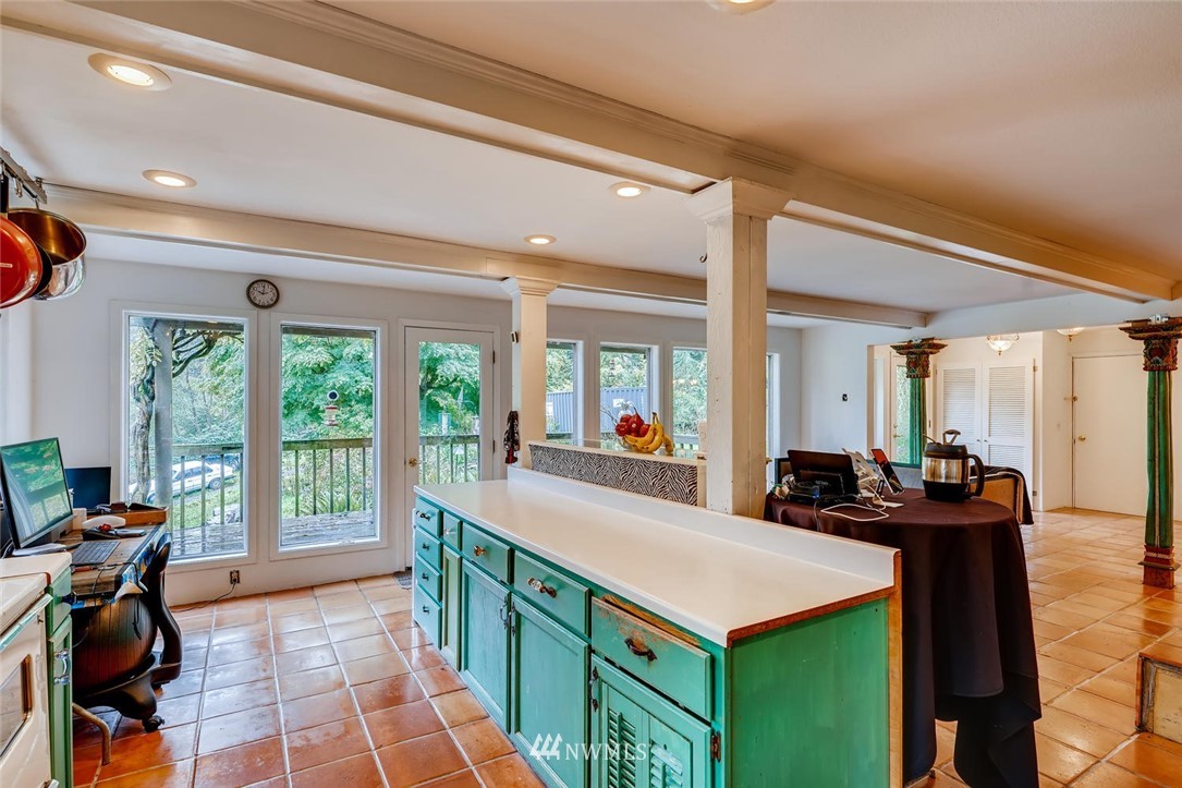 21612 High Bridge Road Monroe, WA 98272 - Photo 8 of 22 a kitchen with sink a table and chairs in it