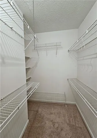 a view of a room with racks on the wall