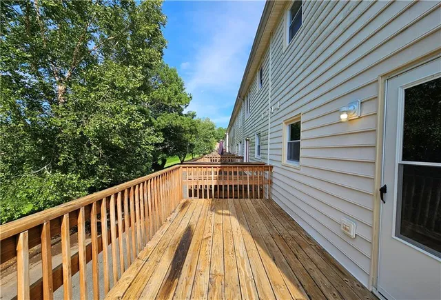 a view of balcony with wooden floor