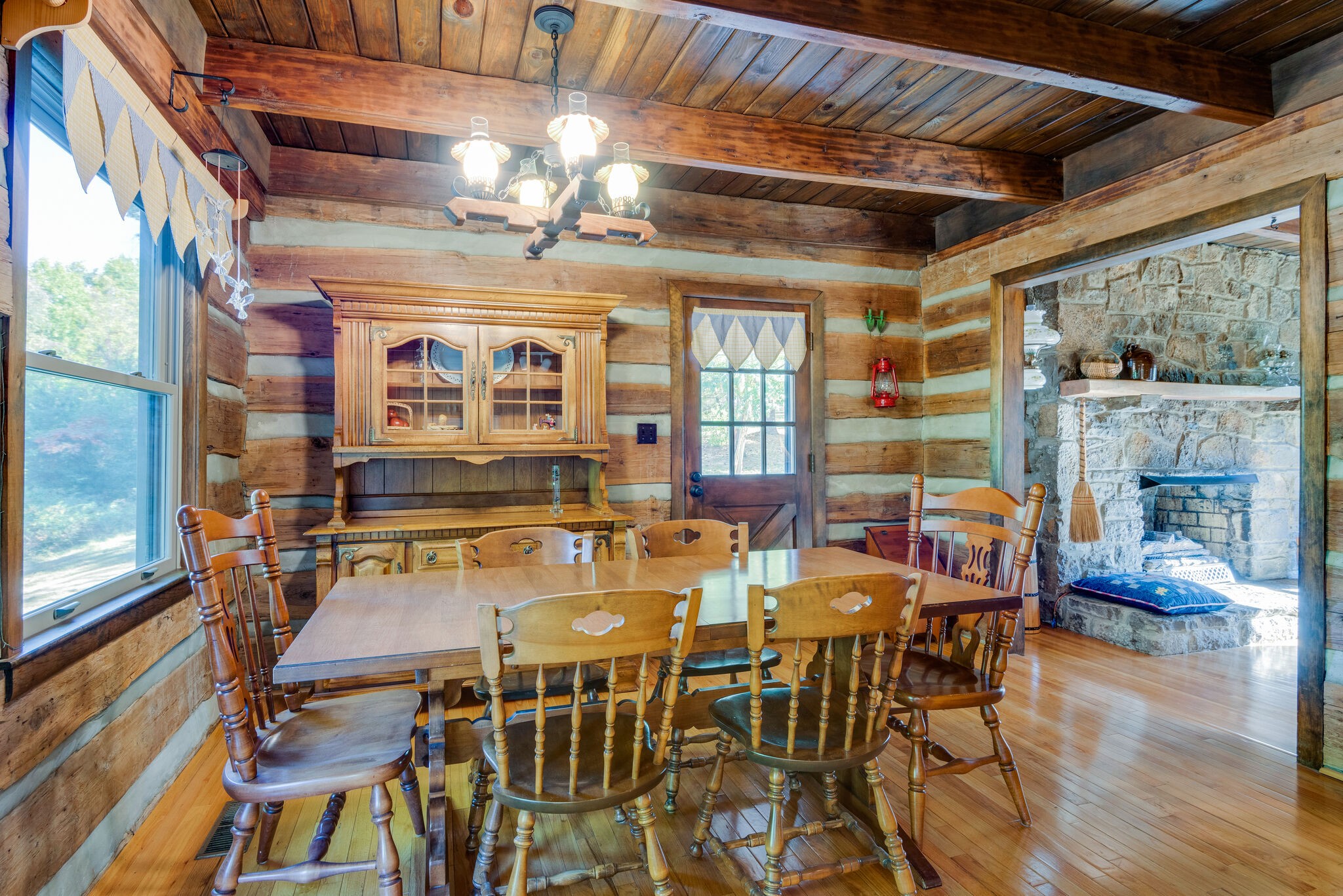 3093 Ivey Point Road Goodlettsville, TN 37072 - Photo 11 of 40 a view of a dining room with furniture wooden floor and a chandelier