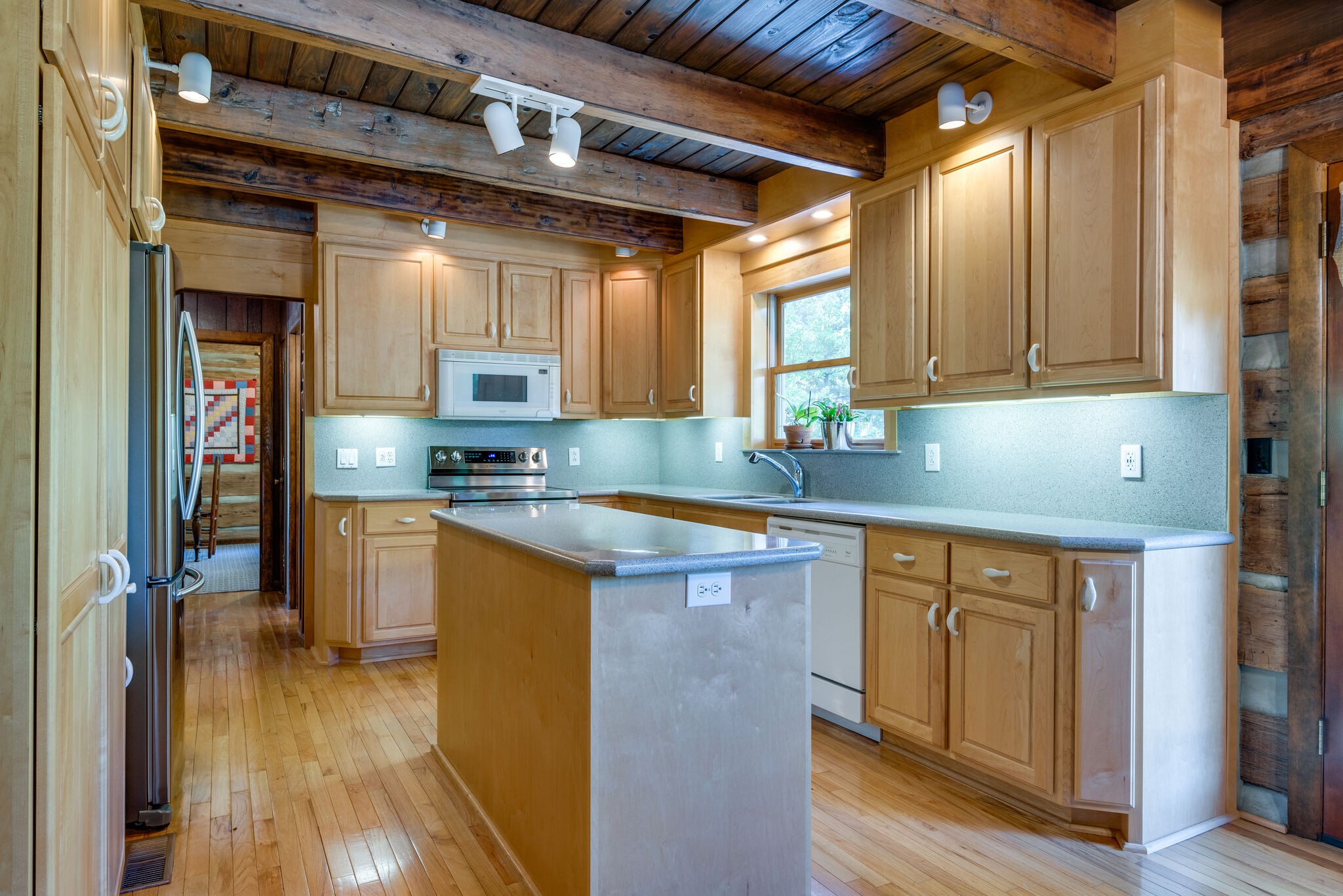 3093 Ivey Point Road Goodlettsville, TN 37072 - Photo 12 of 40 a kitchen with stainless steel appliances granite countertop a sink a stove and cabinets