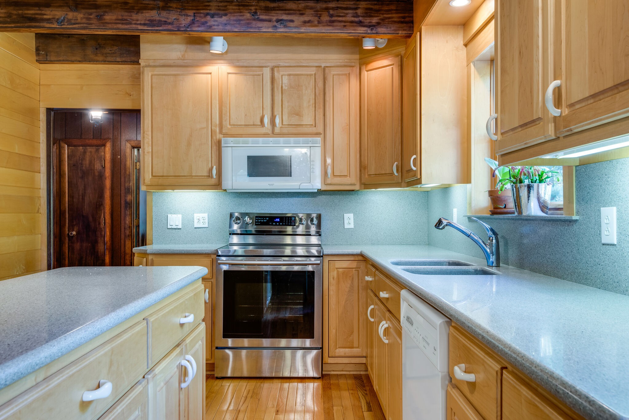 3093 Ivey Point Road Goodlettsville, TN 37072 - Photo 13 of 40 a kitchen with stainless steel appliances granite countertop a sink stove and cabinets