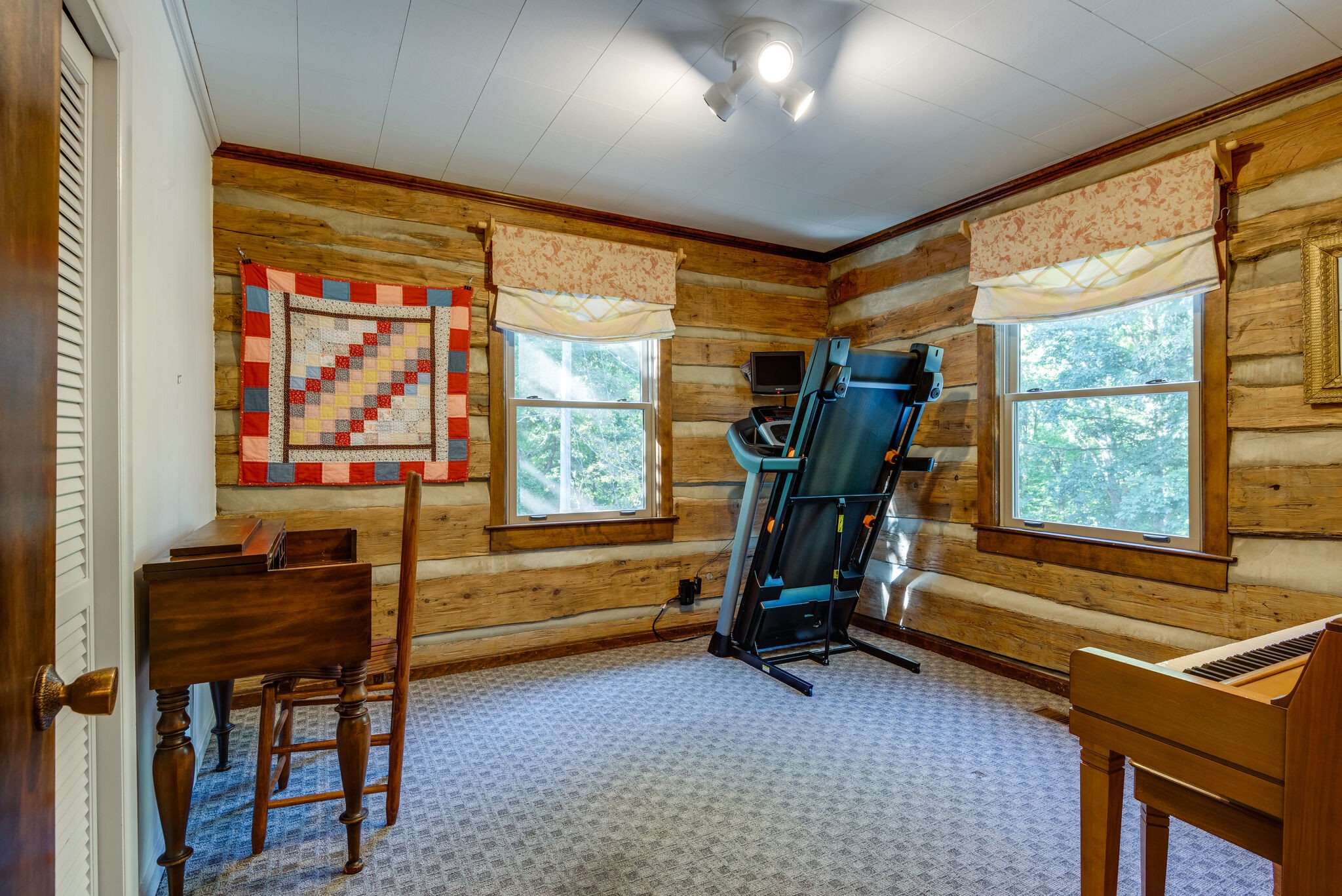 3093 Ivey Point Road Goodlettsville, TN 37072 - Photo 21 of 40 a view of a room with gym equipment and windows