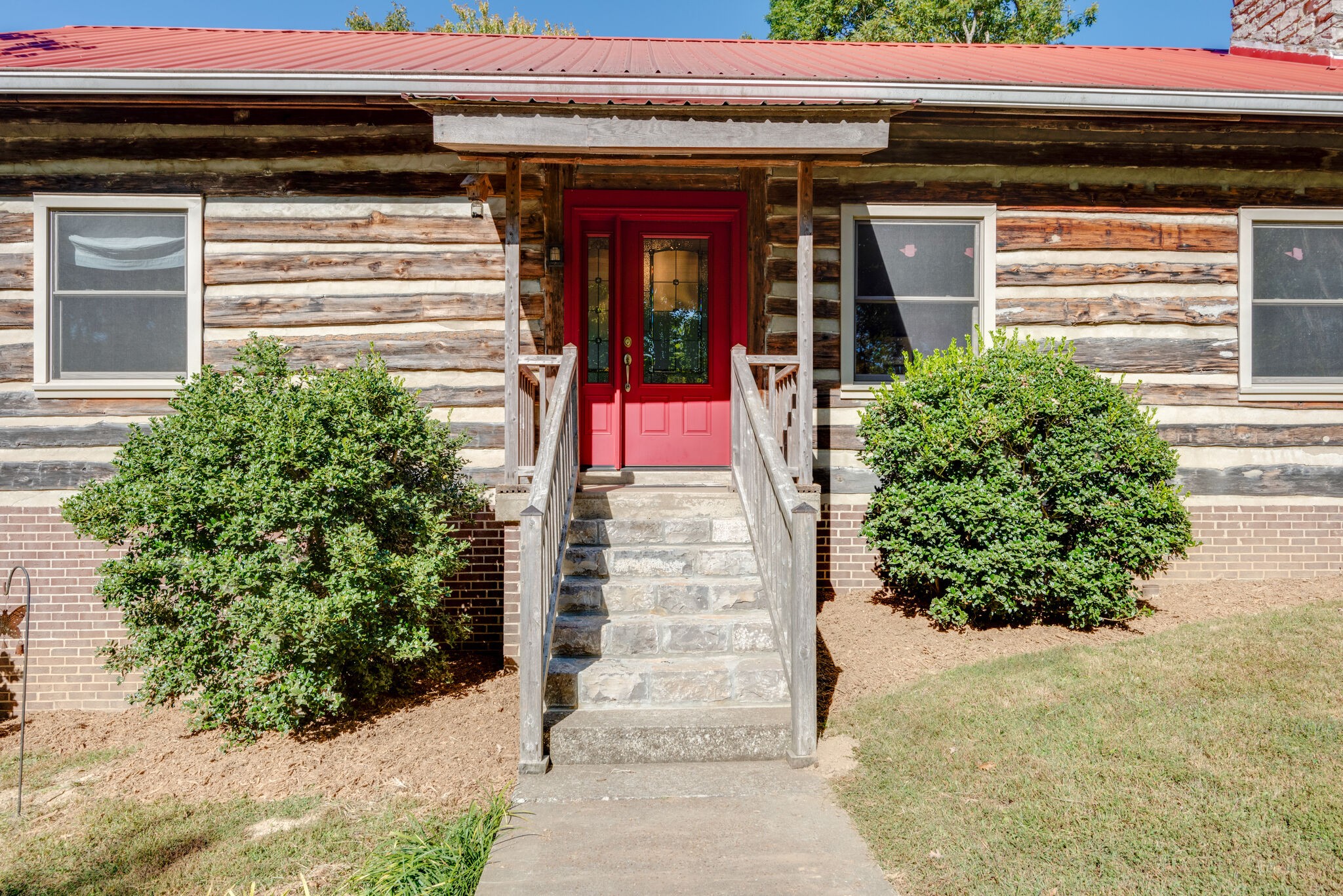 3093 Ivey Point Road Goodlettsville, TN 37072 - Photo 5 of 40 a front view of a house with potted plants