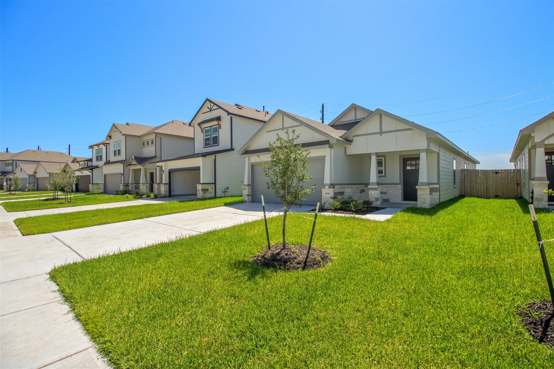 6643 Escondido Drive Rosharon, TX 77583 - Photo 2 of 25 a front view of a house with a yard