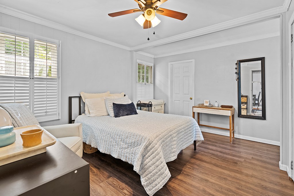 2176 Longview Road Cross Hill, SC 29332 - Photo 11 of 17 a bedroom with a bed and a chandelier