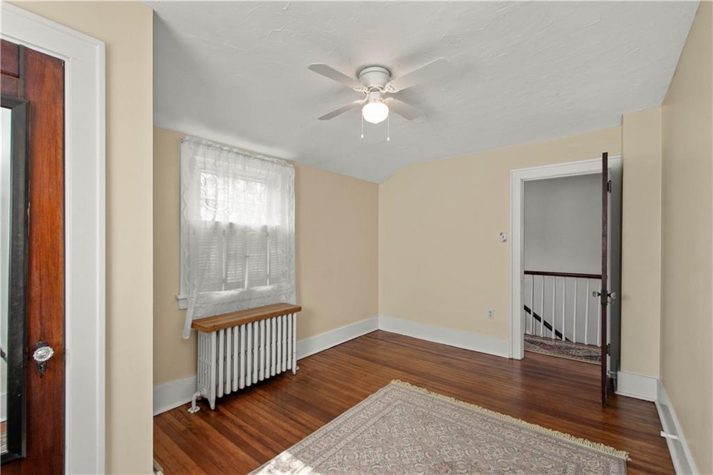 705 Walnut Street Crescent, PA 15046 - Photo 27 of 41 a view of an empty room with wooden floor and a window