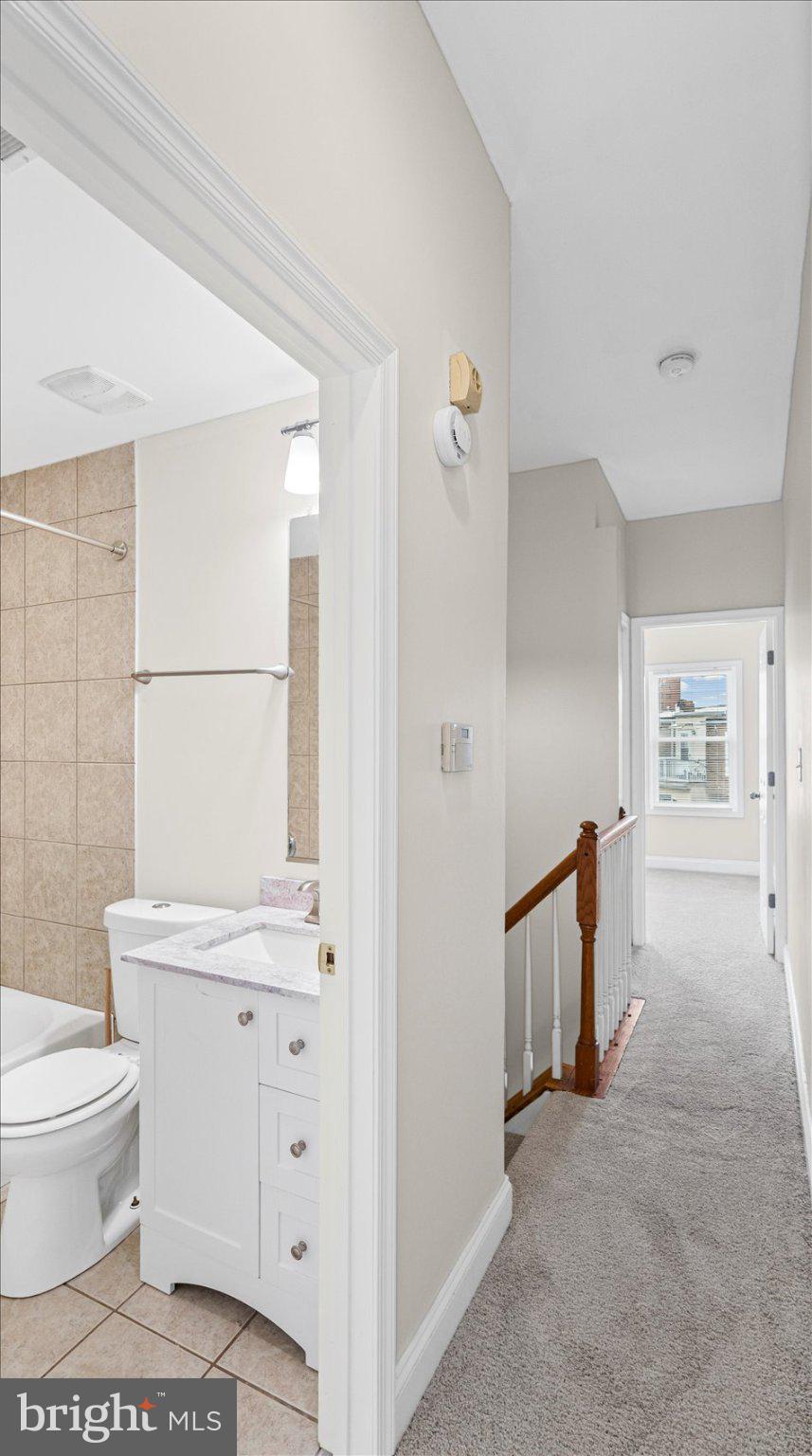 847 Carroll Street Baltimore, MD 21230 - Photo 25 of 33 Bright hallway with modern bath access.