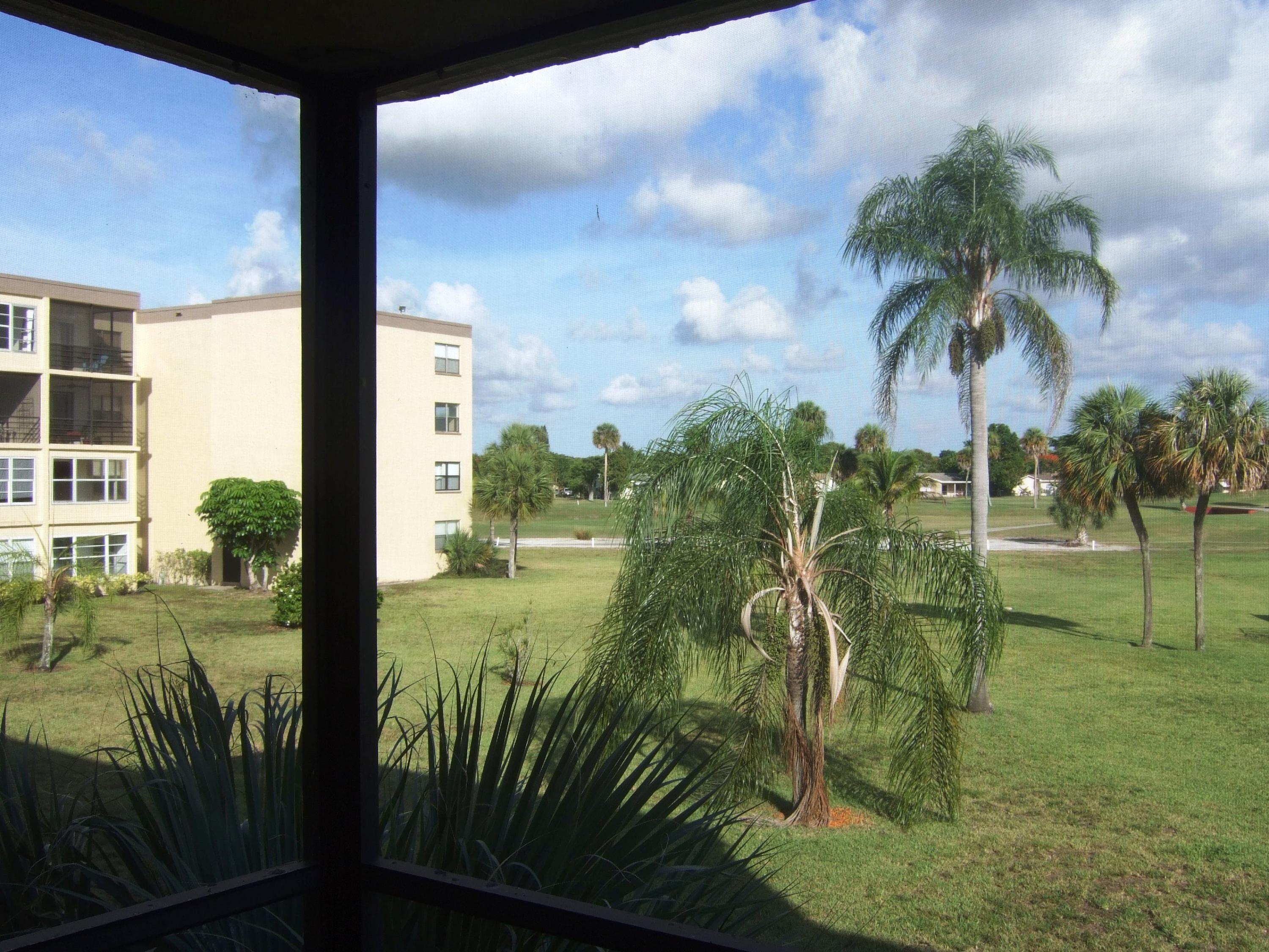 9355 Southwest 8th Street, Unit 211 Boca Raton, FL 33428 - Photo 7 of 13 View from Screened in Porch