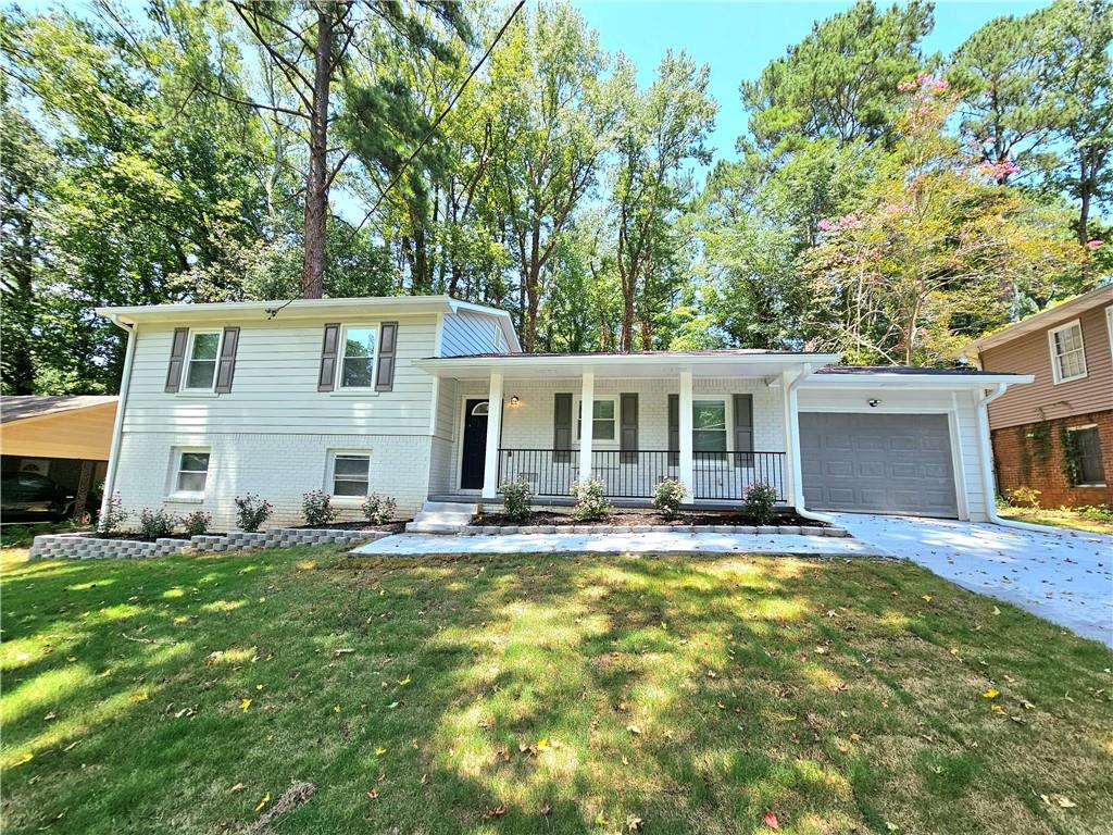 3986 Maplewood Drive Decatur, GA 30035 - Photo 1 of 1 a view of a house with a big yard and large tree