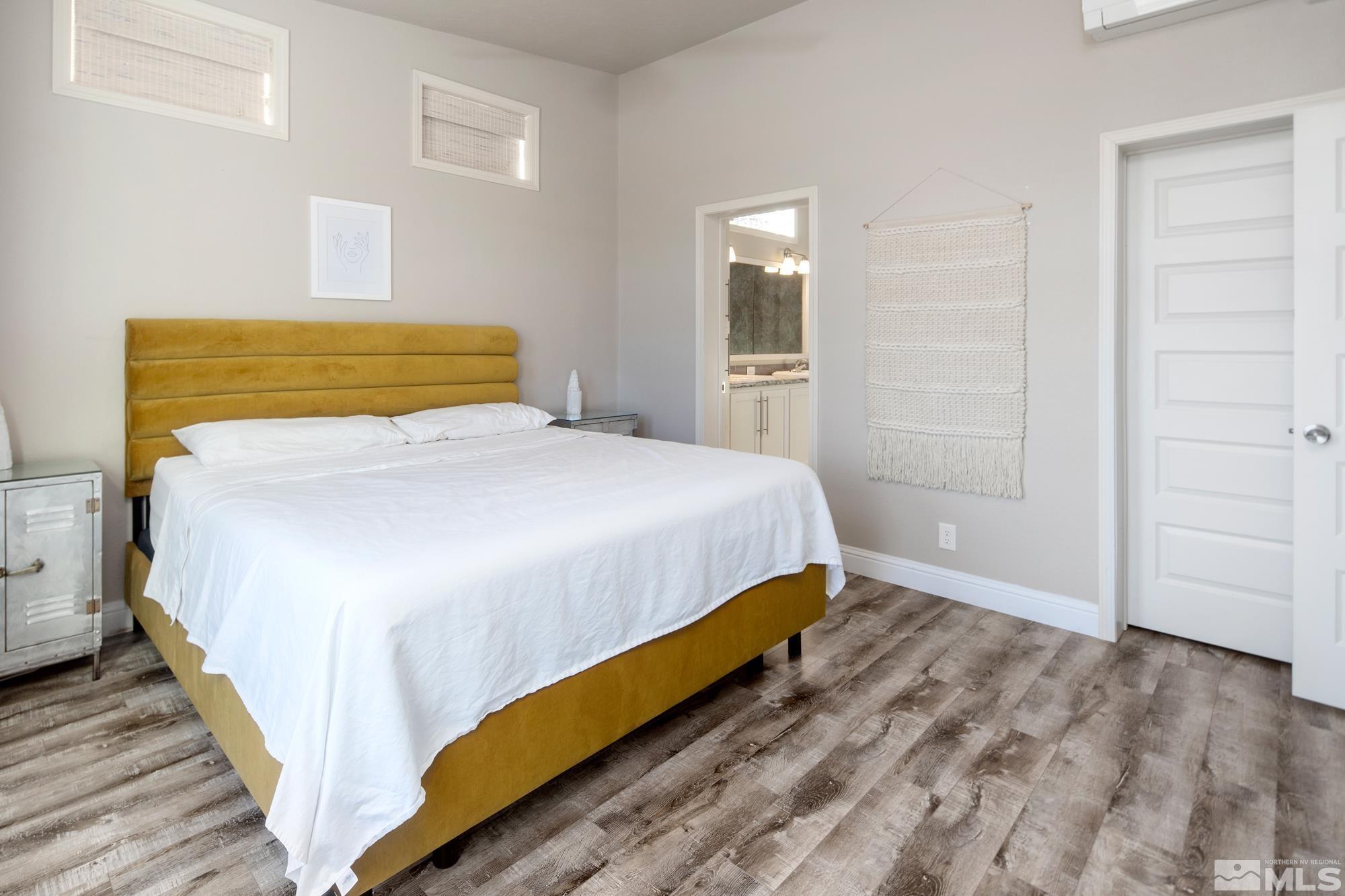 900 Ironwood Road Reno, NV 89510 - Photo 11 of 40 a bedroom with a bed and wooden floor