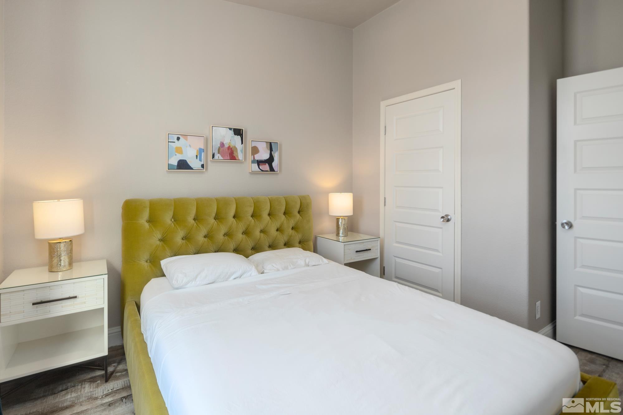 900 Ironwood Road Reno, NV 89510 - Photo 18 of 40 a bedroom with a bed and a lamp on dresser