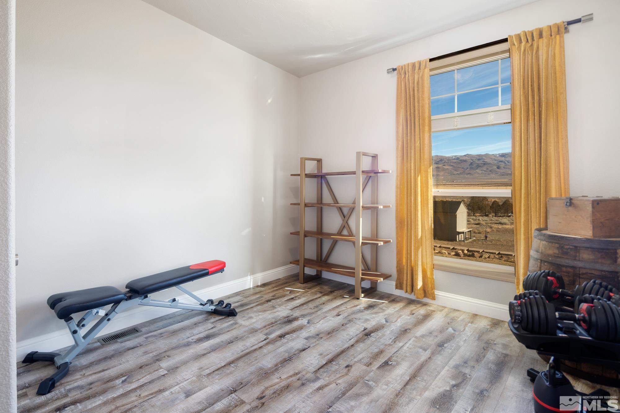 900 Ironwood Road Reno, NV 89510 - Photo 19 of 40 a bedroom with bed and a large window