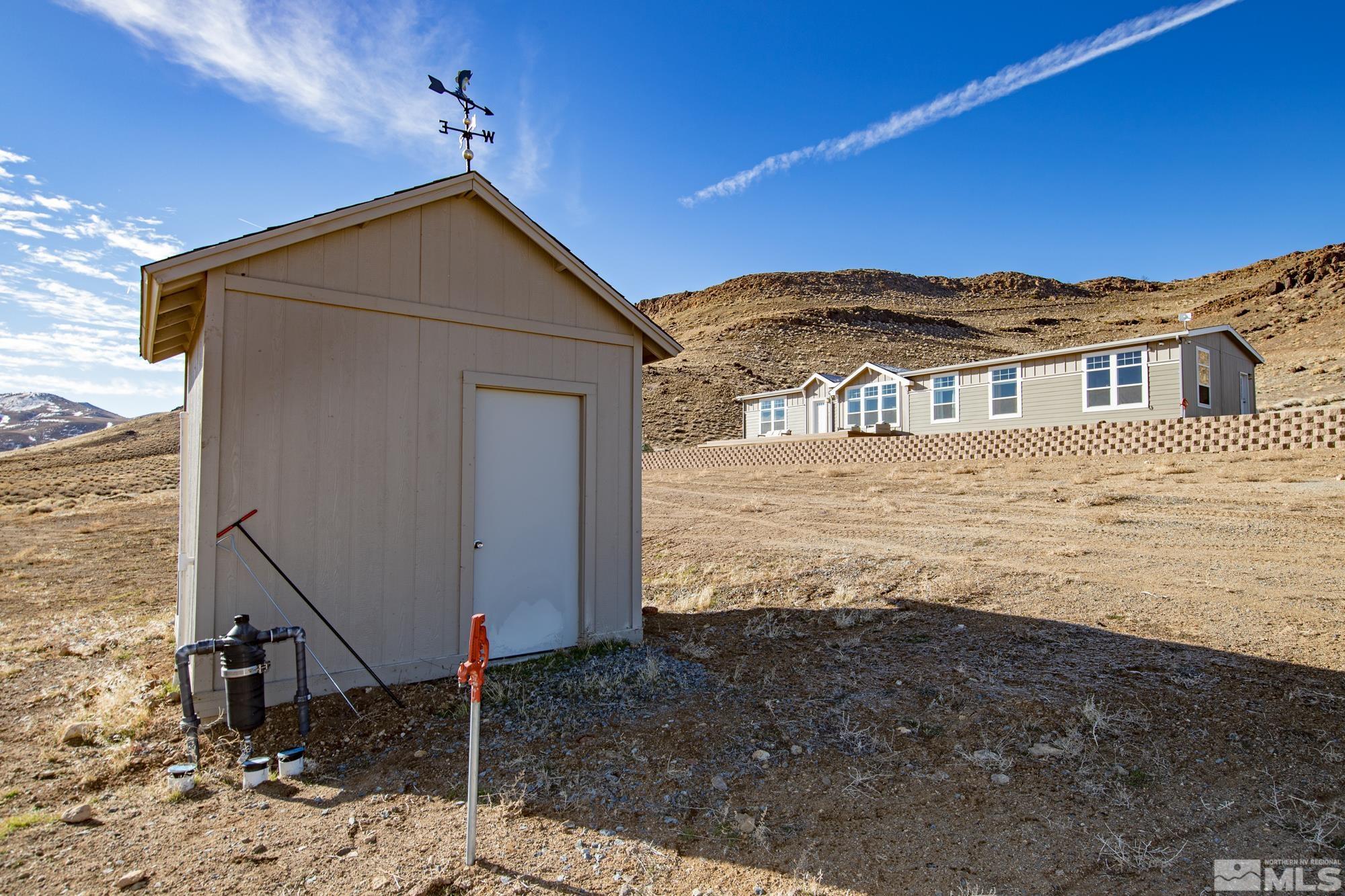 900 Ironwood Road Reno, NV 89510 - Photo 29 of 40 a view of a house with a yard