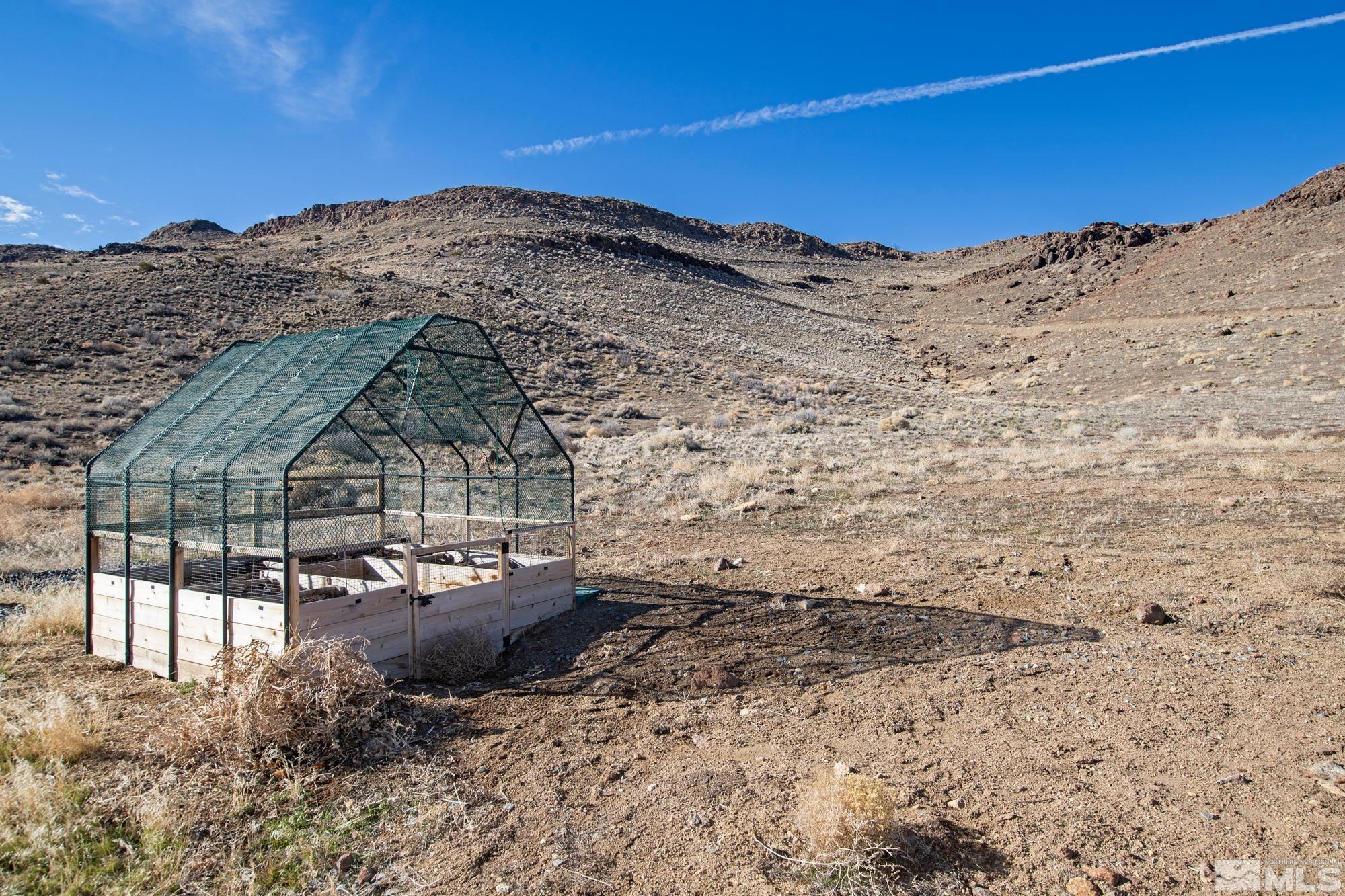900 Ironwood Road Reno, NV 89510 - Photo 30 of 40 a view of a house with a mountain in the background