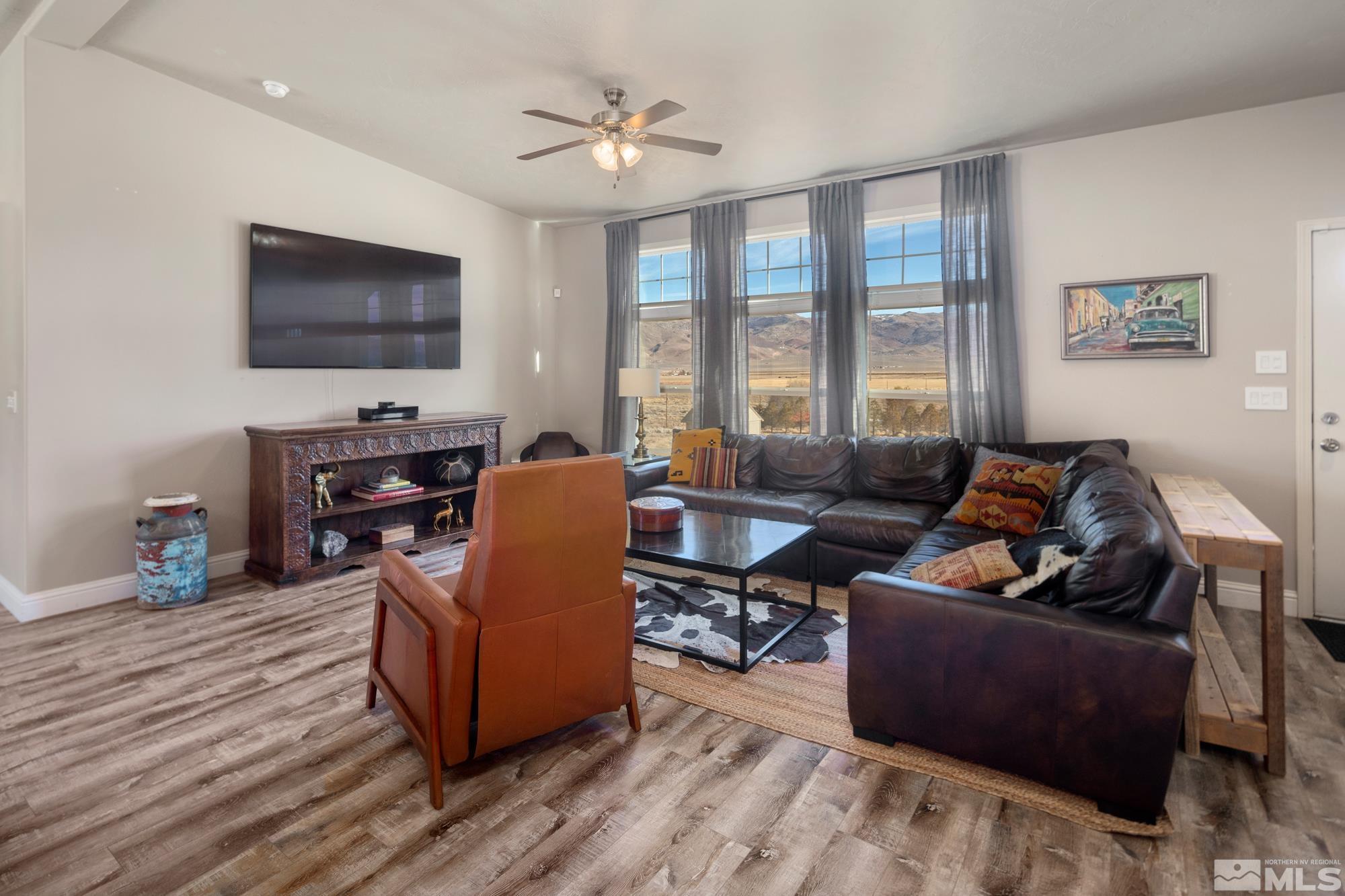 900 Ironwood Road Reno, NV 89510 - Photo 3 of 40 a living room with furniture fireplace and a flat screen tv