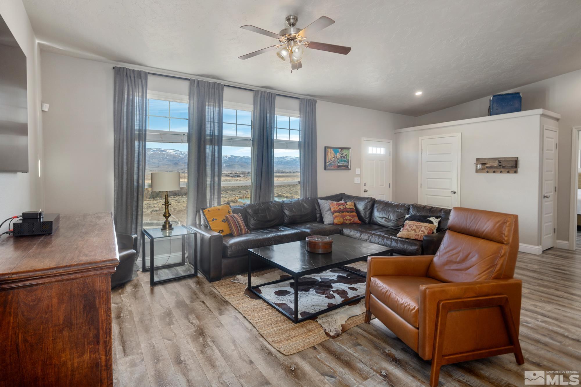 900 Ironwood Road Reno, NV 89510 - Photo 4 of 40 a living room with furniture a wooden floor and a window