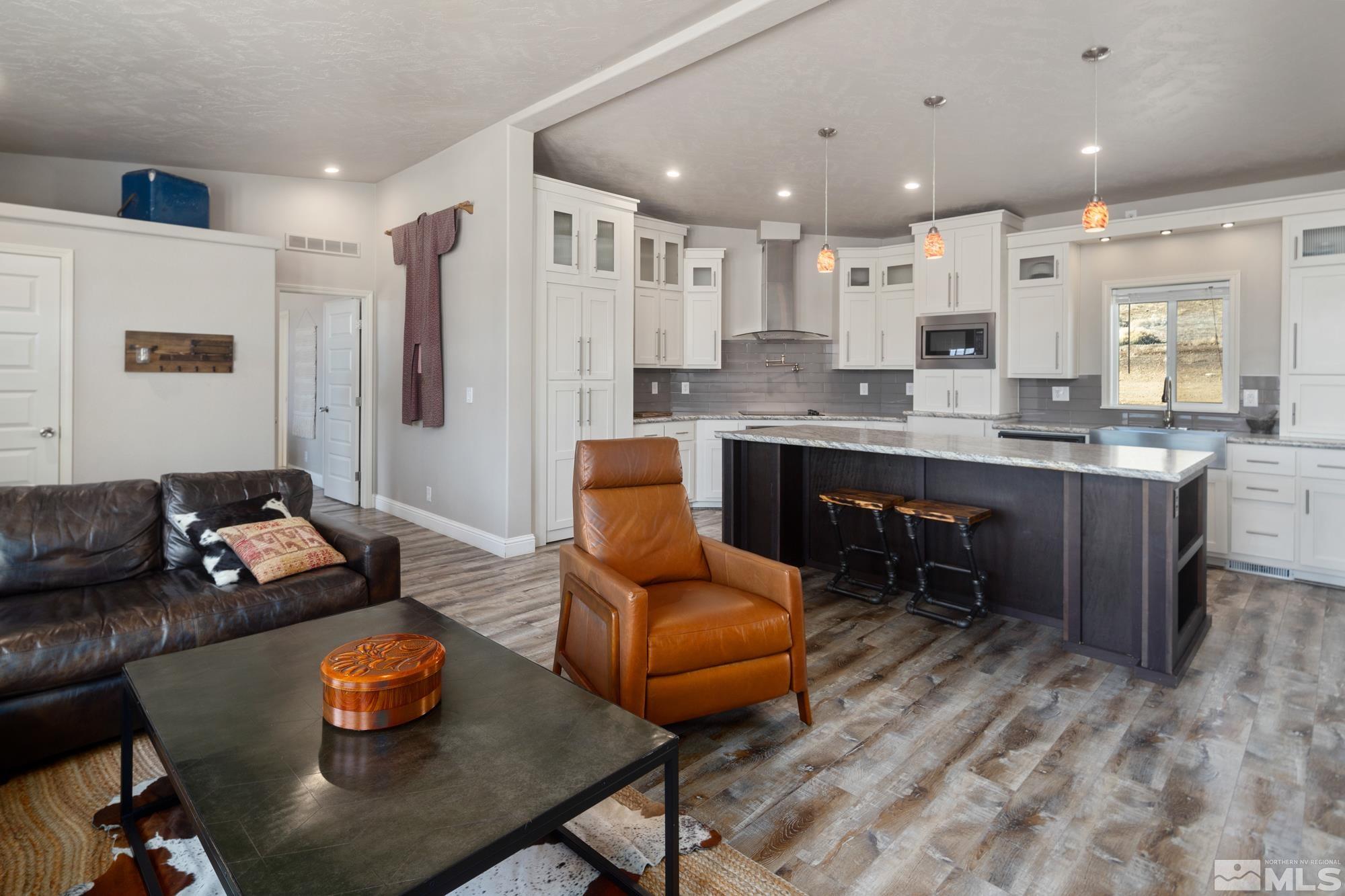 900 Ironwood Road Reno, NV 89510 - Photo 5 of 40 a living room with stainless steel appliances kitchen island granite countertop furniture and a dining table