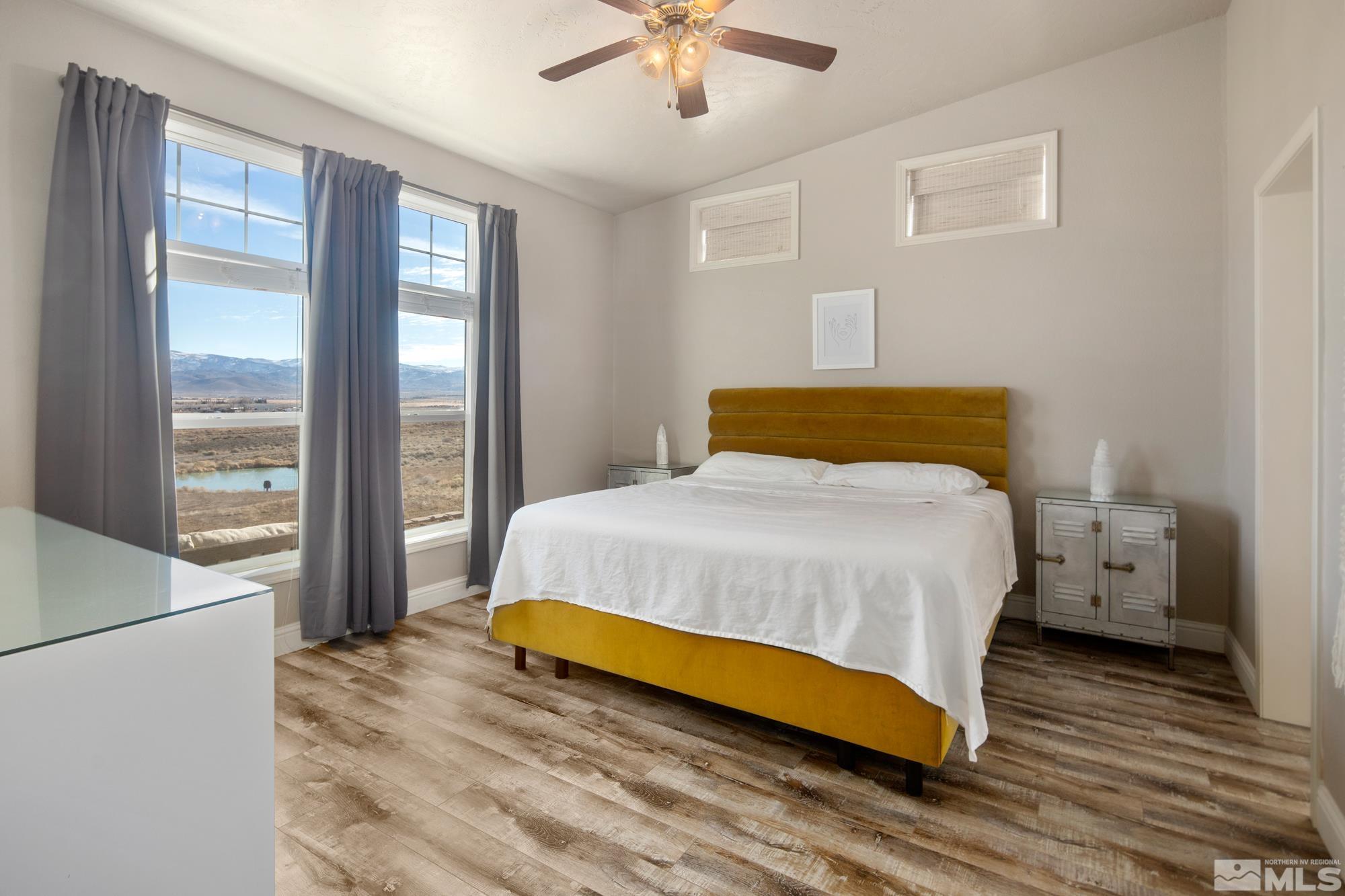 900 Ironwood Road Reno, NV 89510 - Photo 10 of 40 a bedroom with a bed and wooden floor