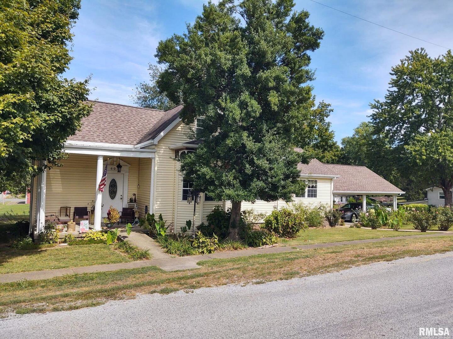 601 Ohio Street Grand Chain, IL 62941 - Photo 1 of 32 a front view of a house with garden and trees
