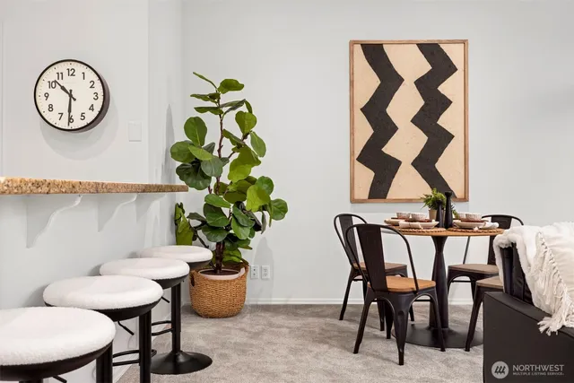 a dining room with furniture and window