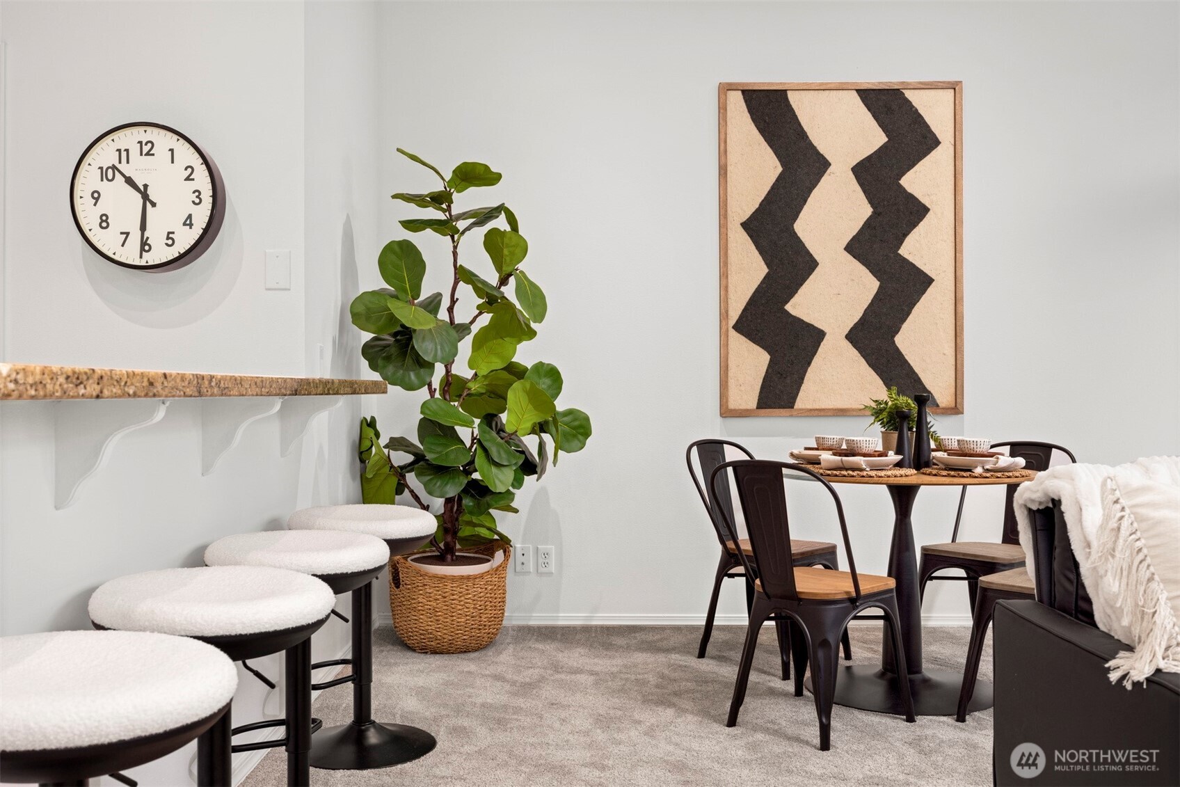 1201 13th Street, Unit 301 Bellingham, WA 98225 - Photo 12 of 38 a view of a dining room with furniture and a potted plant