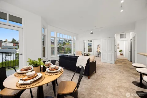 a view of a dining room with furniture and window